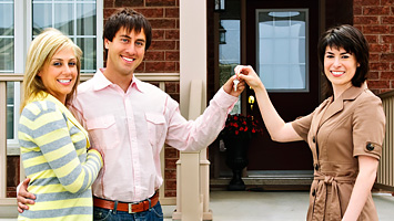 Card image cap showing a smiling couple purchasing a home.